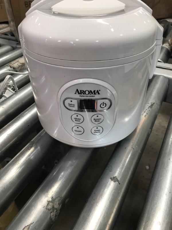 Photo 3 of **** USED ****
Aroma Housewares 8-Cup (Cooked) (4-Cup UNCOOKED) Digital Rice Cooker and Food Steamer (ARC-914D),White