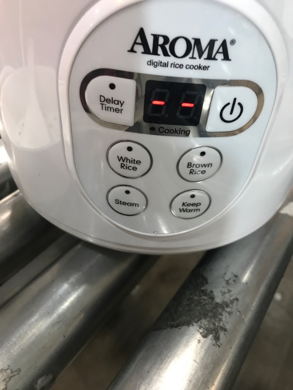 Photo 2 of **** USED ****
Aroma Housewares 8-Cup (Cooked) (4-Cup UNCOOKED) Digital Rice Cooker and Food Steamer (ARC-914D),White