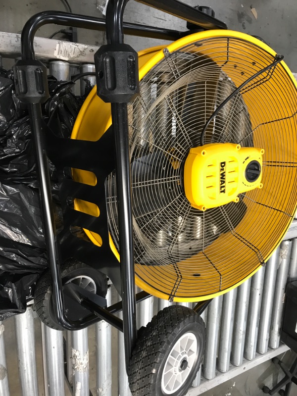 Photo 4 of **NON FUNCTIONAL** DOESNT POWER ON WHEN TESTED** DEWALT Drum Fan High-Velocity Industrial, Drum, Floor, Barn, Warehouse Fan, Heavy Duty Air Mover with Adjustable Tilt & Large Wheel, 24", Yellow DXF2490
