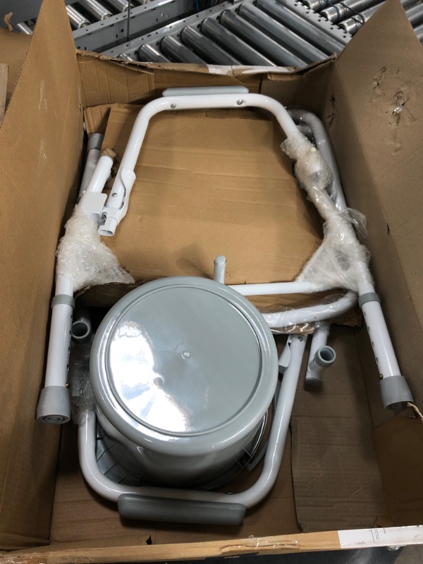 Photo 2 of Medline Drop Arm Commode, Swing Arm Rest for Easy Transfer, Padded Seat, Contains Chair, Pail, Lid, and Splash Guard, 350lb. Weight Capacity
