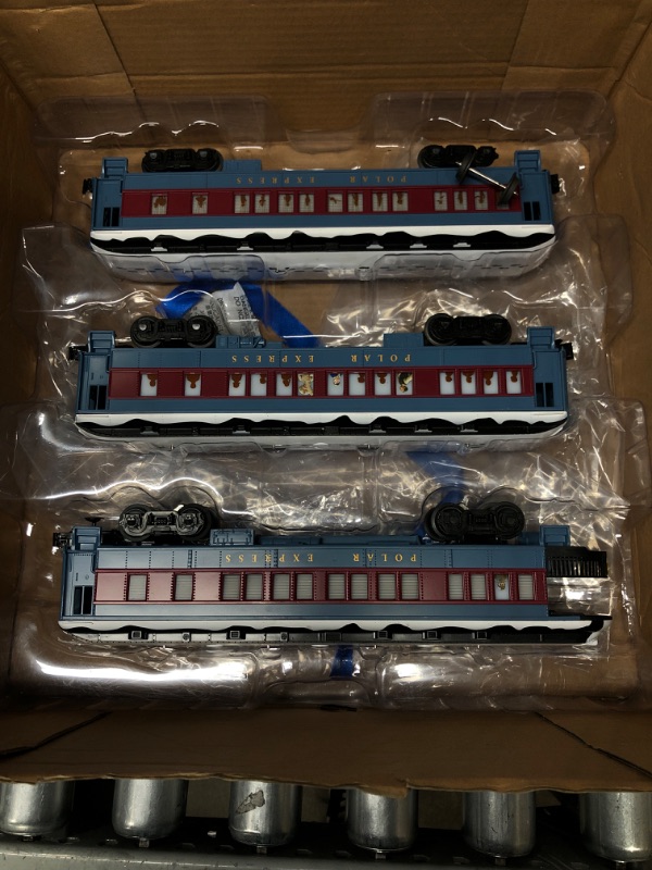 Photo 4 of Lionel The Polar Express Electric O Gauge Model Train Set with Remote and Bluetooth + 4-Piece Straight Track Expansion Complete Set + Expansion Track (Straight)