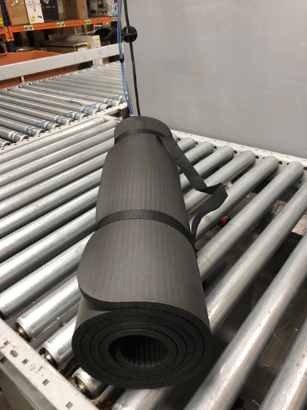 Photo 1 of Gaiam Essentials Thick Yoga Mat Fitness & Exercise Mat with Easy-Cinch Yoga Mat Carrier Strap, 72"L x 24"W x 2/5 inch Thick Black

