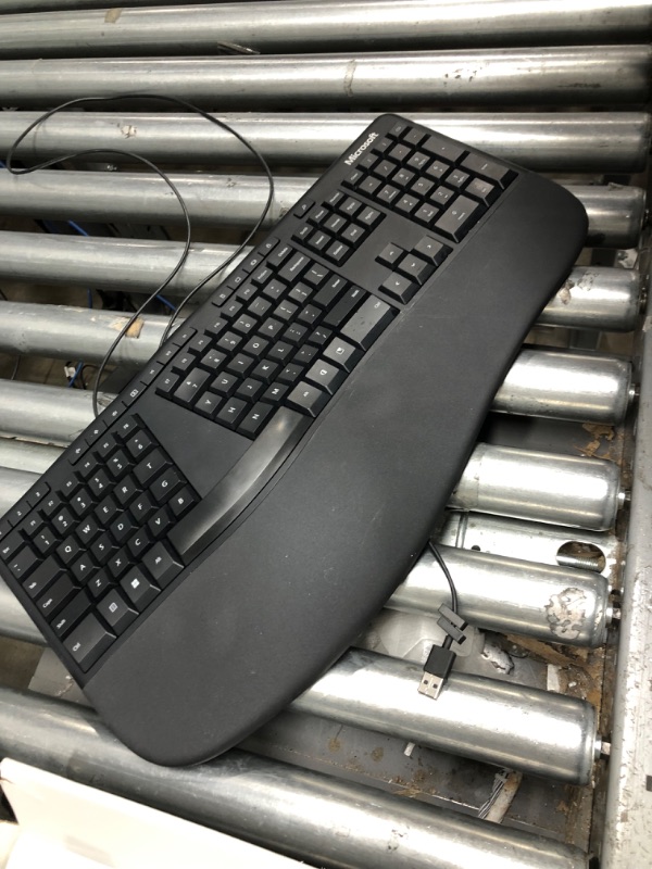 Photo 2 of Microsoft Ergonomic Keyboard - Black. Wired, Comfortable, Ergonomic Keyboard with Cushioned Wrist and Palm Support. Split Keyboard. Dedicated Office Key.
