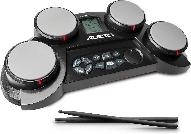 Photo 1 of Alesis CompactKit 4 – Tabletop Electric Drum Set with 70 Electronic and Acoustic Drum Kit Sounds, 4 Pads, and Drum Sticks
