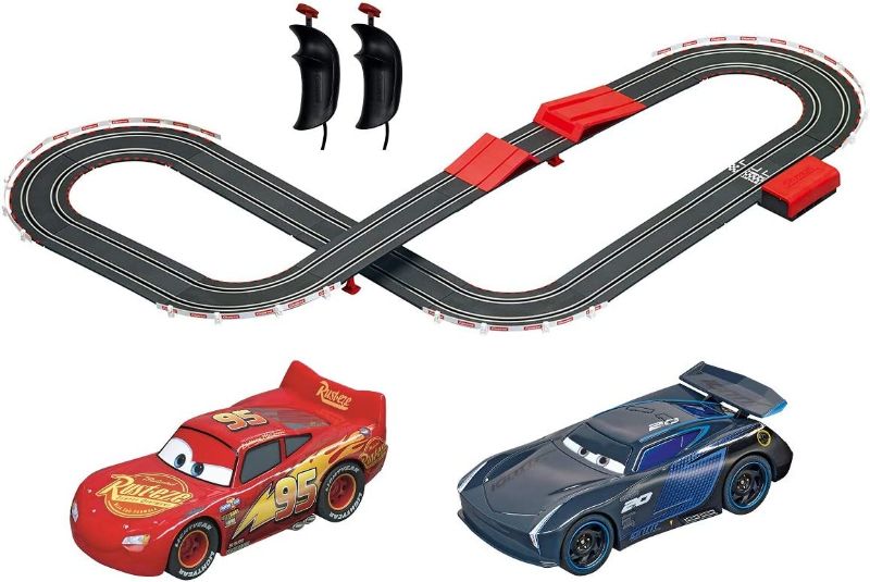 Photo 1 of Carrera GO!!! 63516 Official Licensed Disney Pixar Cars Battery Operated 1:43 Scale Slot Car Racing Toy Track Set with Jump Ramp Featuring Lightning McQueen and Jackson Storm for Kids Ages 5 and Up
