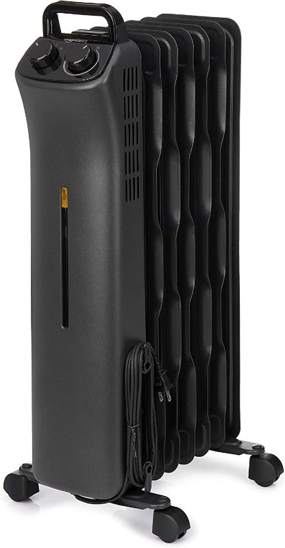 Photo 1 of Amazon Basics Portable Radiator Heater with 7 Wavy Fins, Manual Control, Black, 1500W
