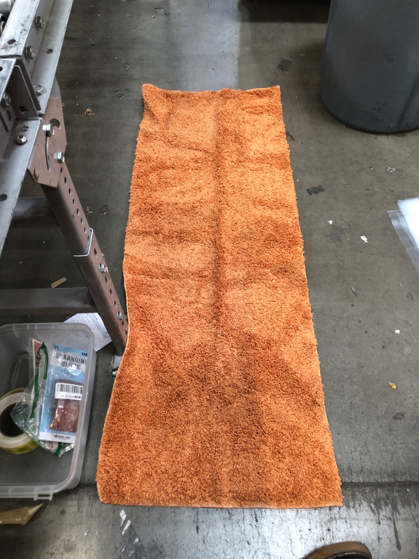 Photo 1 of 2' x 6' orange threshold rug 