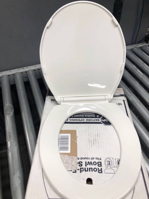 Photo 3 of Kohler 4775-0 Brevia Round Toilet Seat with Grip Tight Bumpers, Release, Quick Attach Hardware, Color Matched Hinges, White Round White