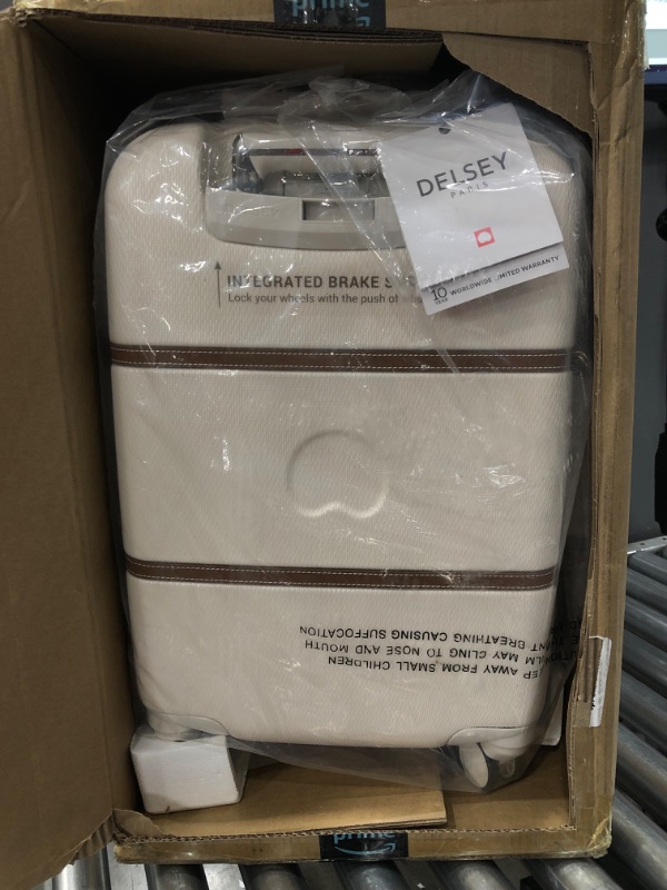 Photo 1 of DELSEY Paris Chatelet Hardside Luggage with Spinner Wheels, Champagne White, Carry-on 19 Inch, No Brake
