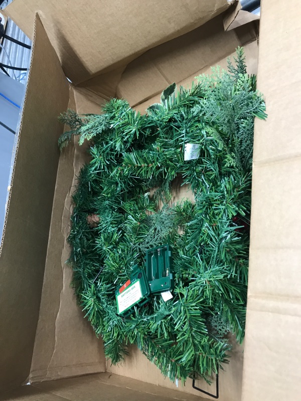 Photo 2 of National Tree Company First Traditions Pre-Lit Christmas Evergeen Wreath with Pinecones and Berries, Warm White LED Lights, Battery Operated, 24 in