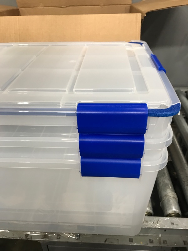 Photo 5 of IRIS USA 60 Quart WEATHERPRO Plastic Storage Box with Durable Lid and Seal and Secure Latching Buckles, Clear With Blue Buckles, Weathertight, 3 Pack 60 Quart - 3 Pack