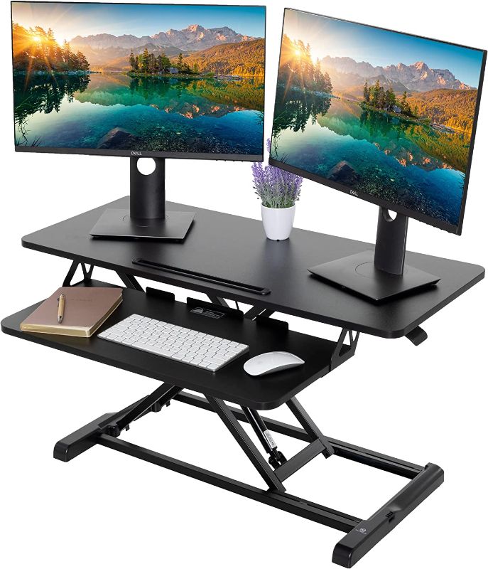 Photo 1 of TechOrbits Standing Desk Converter - Particle Board, Adjustable Height Sit to Stand Up Desk Riser for Home Office - Computer, Laptop & Dual Monitor Workstation & Machine Stand - 36 Inch, Black
