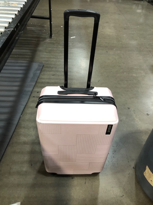 Photo 2 of **minor dent and dirt mark**
American Tourister Stratum XLT Expandable Hardside Luggage with Spinner Wheels, Pink Blush, Checked-Medium 24-Inch
