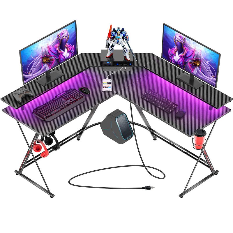 Photo 1 of SEVEN WARRIOR Gaming Desk 50.4” with LED Strip & Power Outlets, L-Shaped Computer Corner Desk Carbon Fiber Surface with Monitor Stand, Ergonomic Gamer Table with Cup Holder, Headphone Hook, Black
