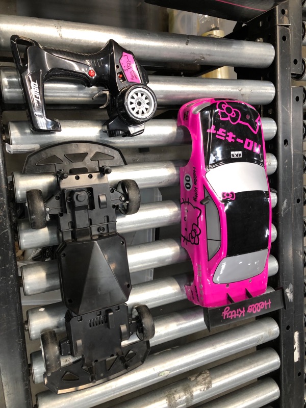 Photo 4 of **used**
Jada Toys Hello Kitty Nissan Skyline GT-R (Bnr34) Drift Power Slide Elite R/C, USB Charging, with 4 Extra Tires, Pink