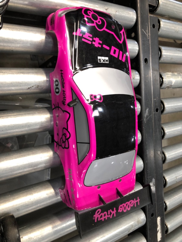 Photo 5 of **used**
Jada Toys Hello Kitty Nissan Skyline GT-R (Bnr34) Drift Power Slide Elite R/C, USB Charging, with 4 Extra Tires, Pink