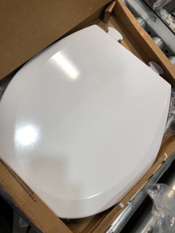 Photo 2 of **opened**
Bemis 500EC 390 Toilet Seat with Easy Clean & Change Hinges, Round, Durable Enameled Wood, Cotton White & Moen P5050 Contemporary Toilet Paper Holder, Chrome Cotton White 1 Pack Round Toilet Seat + Holder, Chrome