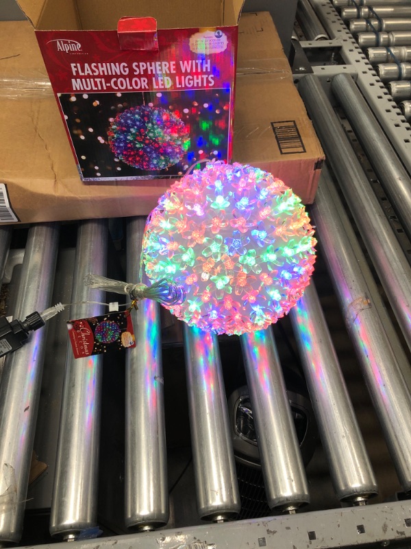 Photo 2 of Alpine Corporation 8" H Indoor/Outdoor Flashing Sphere Hanging Ornament with Multi-Colored LED Lights
