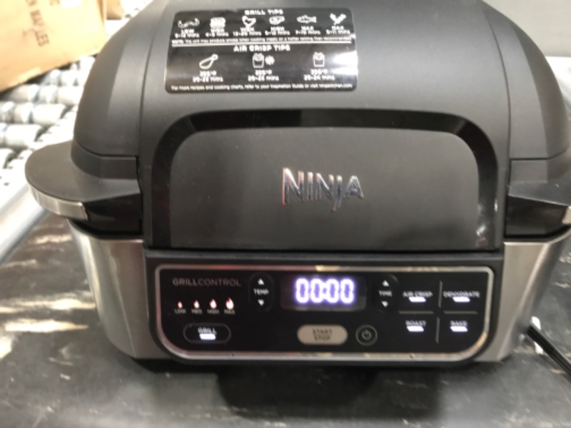 Photo 2 of  TRAY IS BENT, POWERS ON  Ninja DZ401 Foodi 10 Quart 6-in-1 DualZone XL 2-Basket Air Fryer with 2 Independent Frying Baskets, Match Cook & Smart Finish to Roast, Broil, Dehydrate & More for Quick, Easy Family-Sized Meals, Grey
