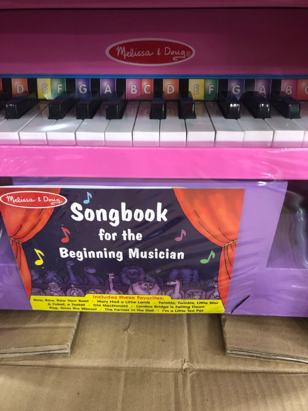 Photo 3 of Melissa & Doug Learn-to-Play Pink Piano With 25 Keys and Color-Coded Songbook 18" x 12.7" x 11.5"
