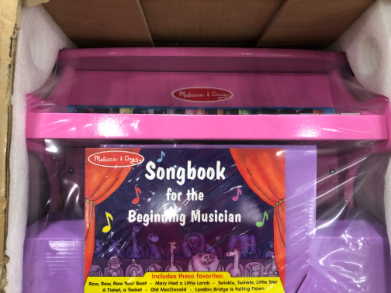 Photo 2 of Melissa & Doug Learn-to-Play Pink Piano With 25 Keys and Color-Coded Songbook 18" x 12.7" x 11.5"
