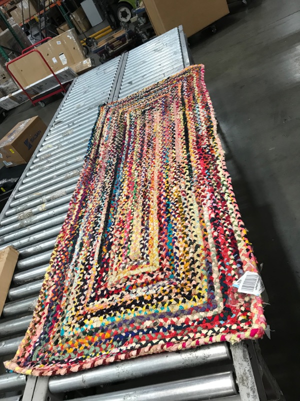 Photo 1 of **used needs cleaning***
30in x 72in multi color design rug, view photos