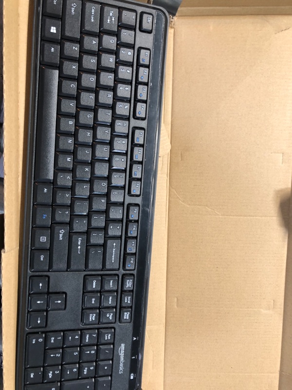 Photo 1 of Amazon Basics Wireless Computer Keyboard and Mouse Combo - Quiet and Compact - US Layout (QWERTY)