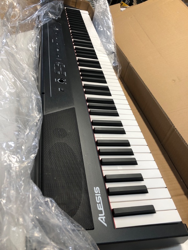 Photo 1 of Alesis Recital – 88 Key Digital Piano Keyboard with Semi Weighted Keys, 2x20W Speakers, 5 Voices, Split, Layer and Lesson Mode, FX and Piano Lessons
