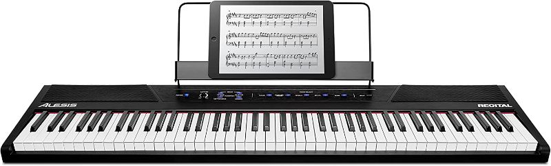 Photo 1 of Alesis Recital – 88 Key Digital Piano Keyboard with Semi Weighted Keys, 2x20W Speakers, 5 Voices, Split, Layer and Lesson Mode, FX and Piano Lessons
