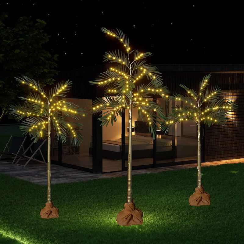 Photo 1 of AWQM 3 Pieces Artificial Palm Tree with Lights, 4FT/5FT/6FT Palm Trees Decor Set, Palm Tree Party Decorations for Home Festival Party Indoor and Outdoor Use, White+Gold+Green
