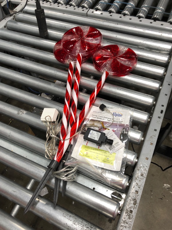 Photo 2 of Alpine Corporation 28" H Outdoor Candy Cane Yard Stakes with Red and White LED Lights (Set of 3)