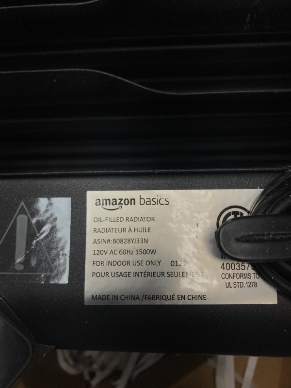 Photo 4 of Amazon Basics Portable Digital Radiator Heater with 7 Wavy Fins and Remote Control, Black, 1500W **Not Turned On**
