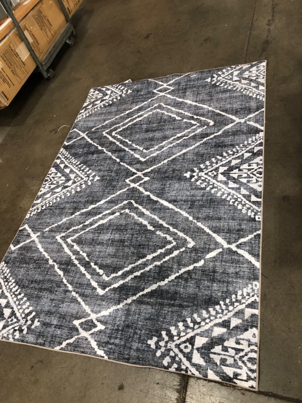 Photo 1 of **USED**
57'W X 83' L DARK BLUE AND WHITE STYLE RUG, VIEW PHOTOS FOR DETAIL