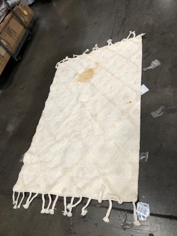 Photo 1 of **stained**
4ft w x 6ft L white rug 