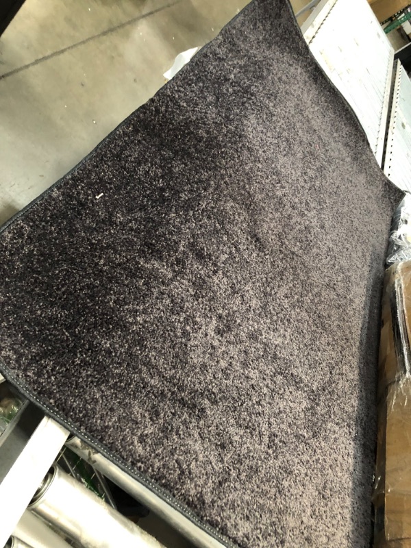 Photo 2 of **USED**
3'FT W X 5'FT L BLACK RUG 