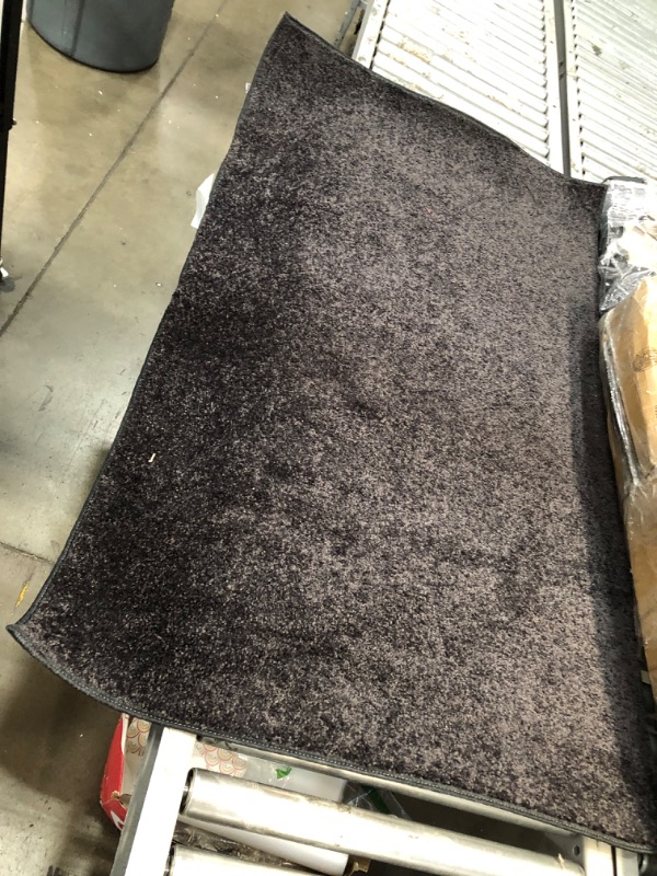 Photo 4 of **USED**
3'FT W X 5'FT L BLACK RUG 