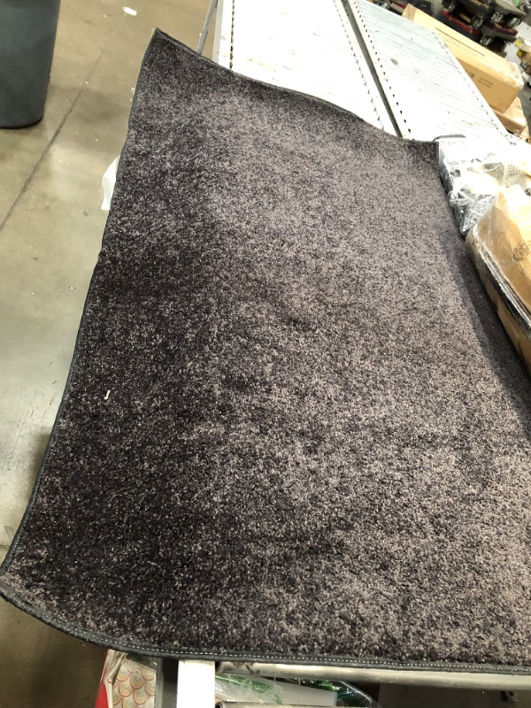 Photo 3 of **USED**
3'FT W X 5'FT L BLACK RUG 