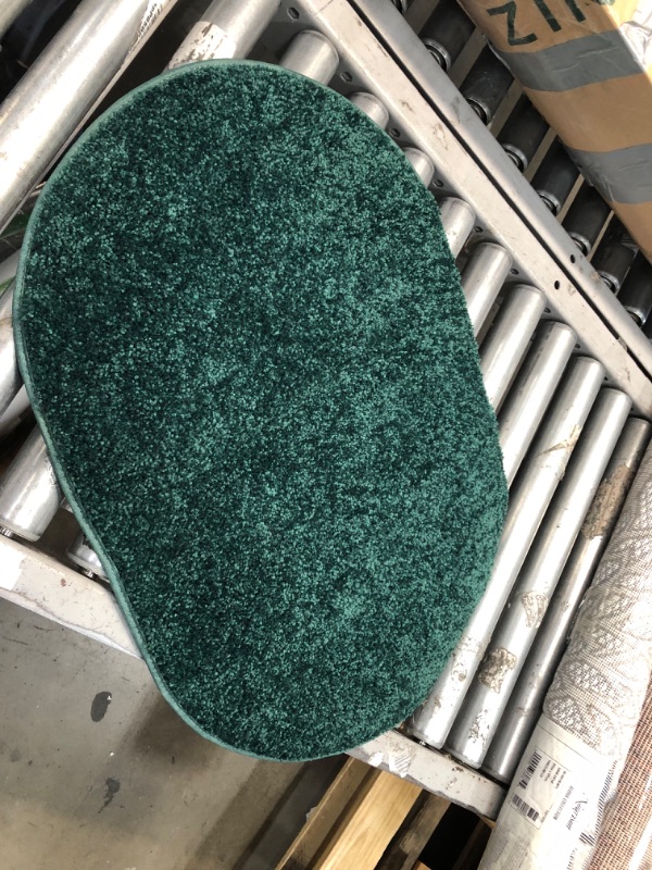 Photo 1 of 27' INCH OVAL DARK GREEN RUG