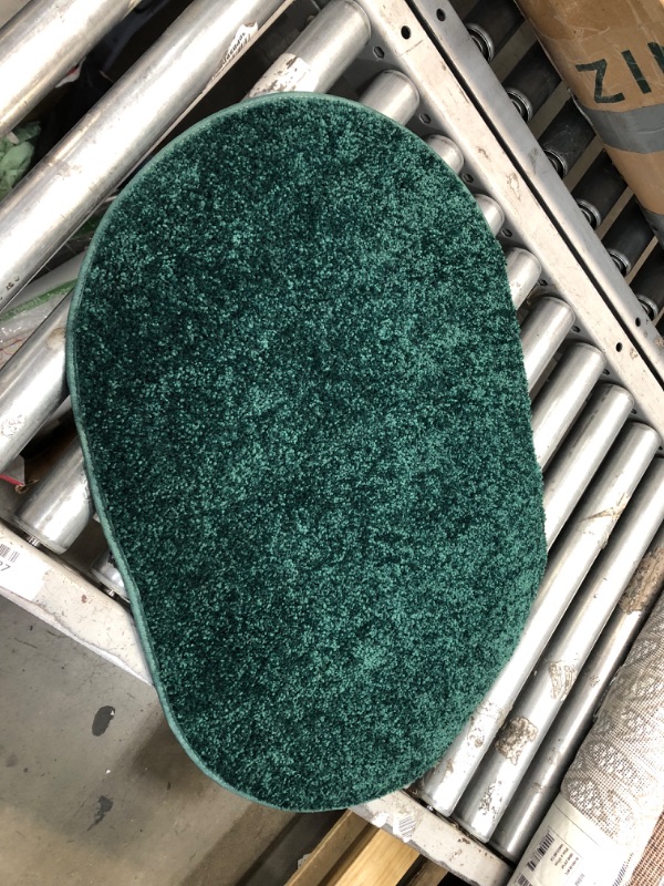 Photo 1 of 27' INCH OVAL DARK GREEN RUG
