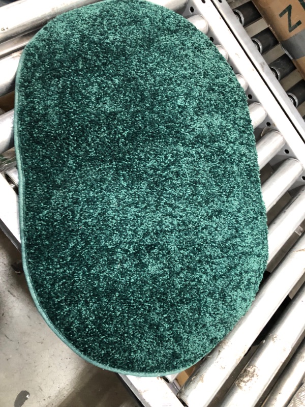 Photo 1 of 27' INCH OVAL DARK GREEN RUG