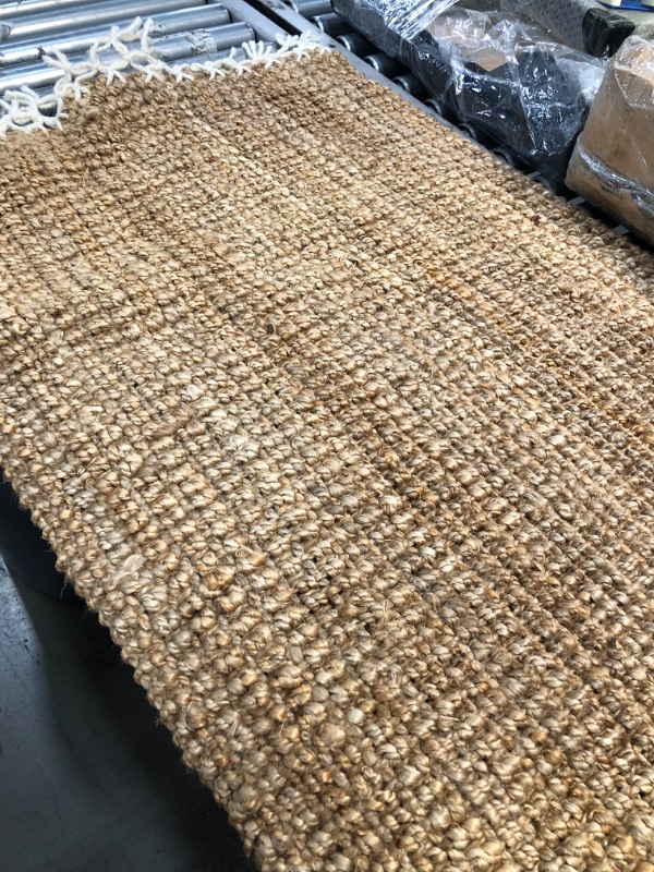 Photo 1 of **NEEDS CLEANING**
30' INCH W X 72| INCH L TAN NATURAL RUG, VIEW PHOTOS