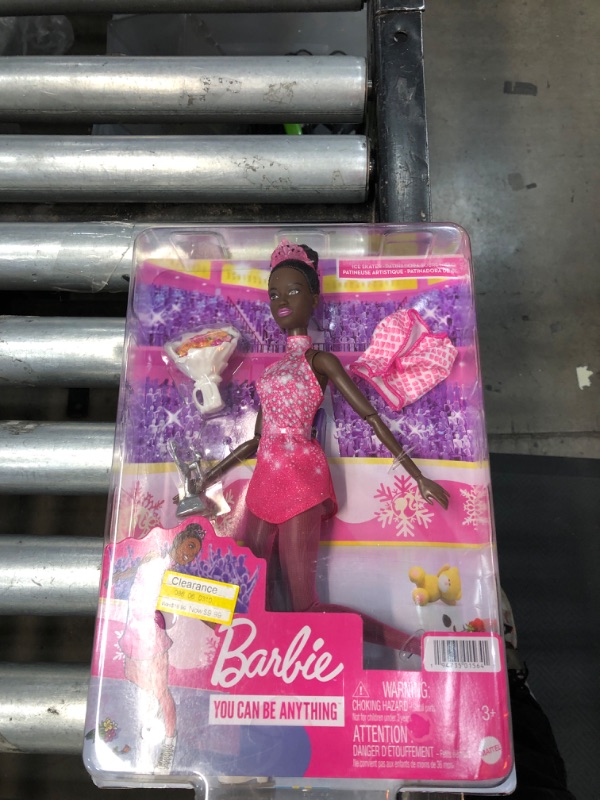 Photo 2 of Barbie Winter Sports Ice Skater Brunette Doll (12 Inches) with Pink Dress, Jacket, Rose Bouquet & Trophy, Great Gift for Ages 3 and Up