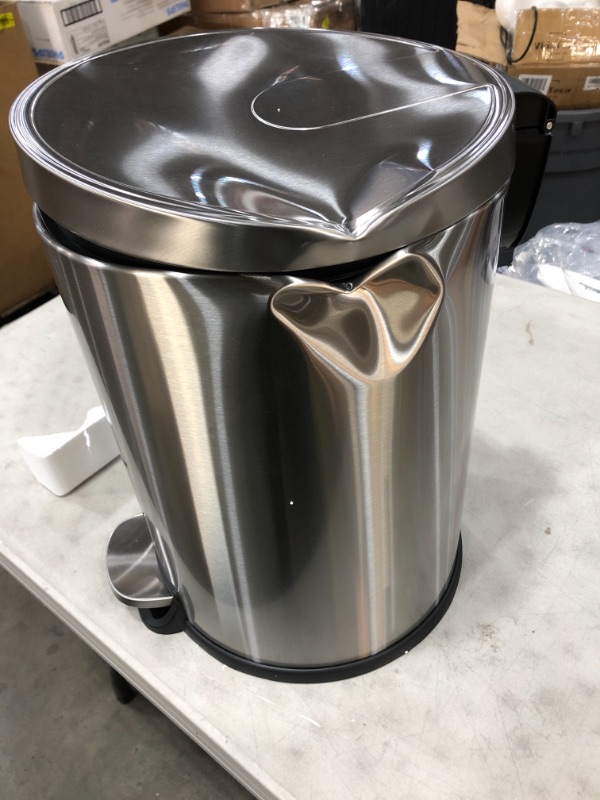 Photo 2 of **DAMAGED** Amazon Basics 20 Liter / 5.3 Gallon Round Soft-Close Trash Can with Foot Pedal - Stainless Steel
