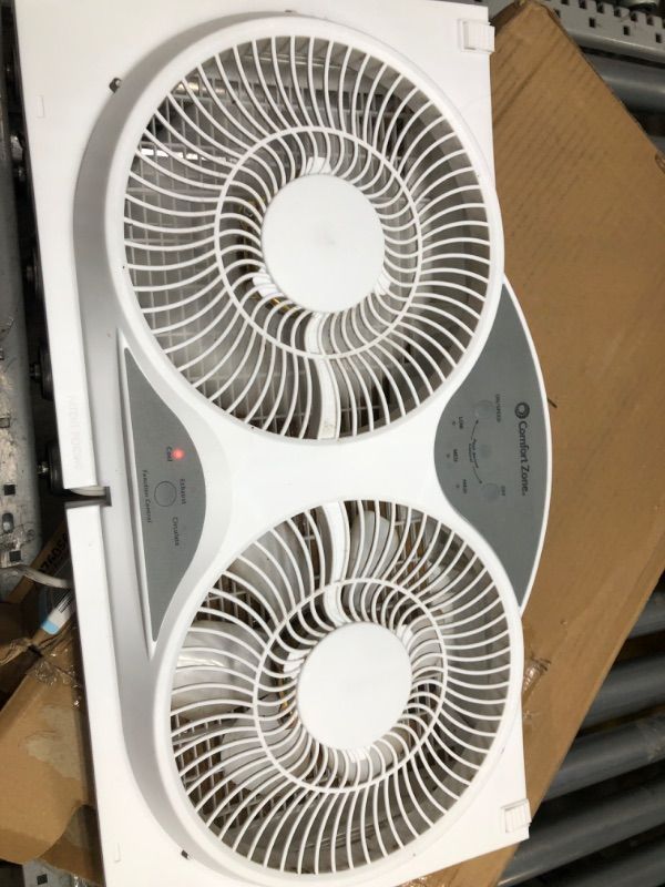 Photo 2 of **ONLY ONE BLADE TURNS** Comfort Zone CZ310R 3-Speed 3-Function Expandable Reversible Twin Window Fan with Remote Control, Removable Cover