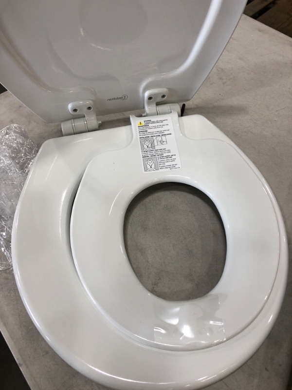 Photo 3 of **MISSING HARDWARE** MAYFAIR 888SLOW 000 NextStep2 Toilet Seat with Built-In Potty Training Seat, Slow-Close, Removable that will Never Loosen, ROUND, White
