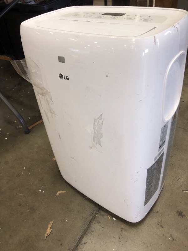 Photo 4 of **HEAVY USE* MISSING PARTS* LG 6,000 BTU (DOE) / 8,000 BTU (ASHRAE) Portable Air Conditioner, Cools 250 Sq.Ft. (10' x 25' room size), Quiet Operation, LCD Remote, Window Installation Kit Included, 115V
