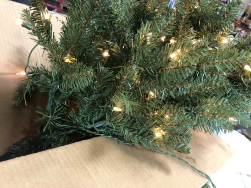 Photo 3 of **TESTED** Puleo International 4.5-Foot Pre-Lit Fraser Fir Pencil 150 UL Clear Lights Artificial Christmas Tree, Ft, Green 4.5' Pencil Fraser Fir with 150 Clear Lights