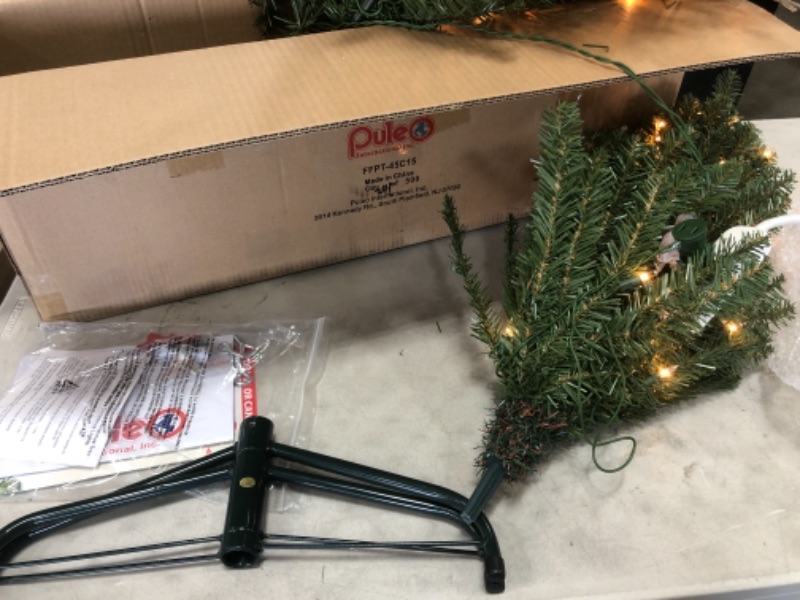 Photo 2 of **TESTED** Puleo International 4.5-Foot Pre-Lit Fraser Fir Pencil 150 UL Clear Lights Artificial Christmas Tree, Ft, Green 4.5' Pencil Fraser Fir with 150 Clear Lights