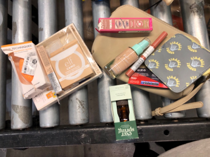 Photo 1 of Assorted Make Up Bundle- Purse, Beauty Blender, Super Stay Ink Crayon, NYX Vegan Brow Mascara,Eucalyptus Essential Oil, Elf Powder, Phusicians Formula Foundation - 9 items 
