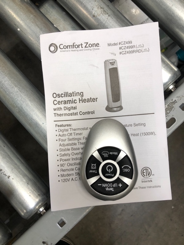 Photo 1 of **NONFUNCTIONAL**
Comfort Zone Oscillating Ceramic Tower Heater CZ499R